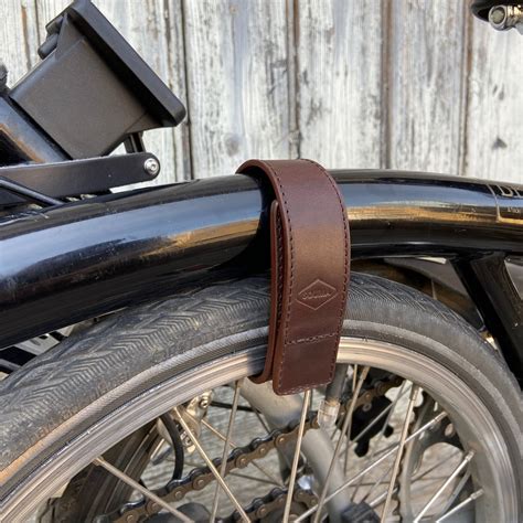 you can roll your folded <strong>Brompton</strong>. . Wheel frame strap brompton